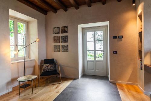 a living room filled with furniture and a window at Relais San Vigilio al Castello in Bergamo