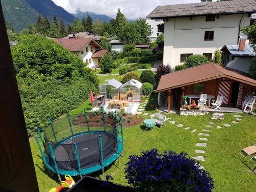 an aerial view of a backyard with a trampoline at Appartementhaus Hollaus in Zell am See