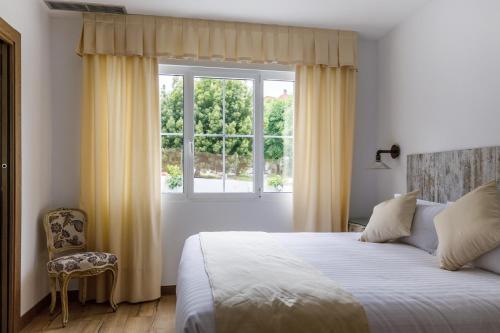 Ένα ή περισσότερα κρεβάτια σε δωμάτιο στο Suite Home Pinares