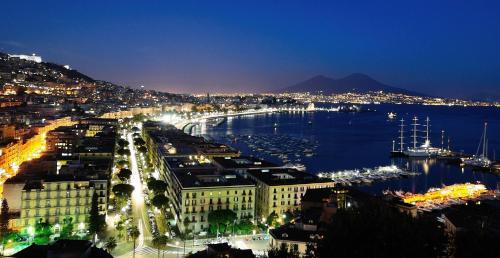 a view of a city at night with a harbor at Villa Miriam in Gragnano