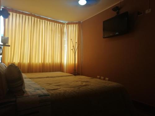 
Cama o camas de una habitación en Hospedaje Oasis

