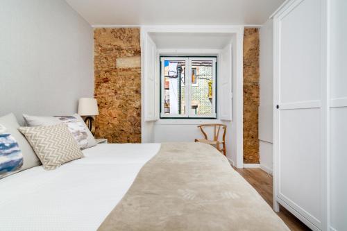 Posteľ alebo postele v izbe v ubytovaní WHome | São Vicente Deluxe Apartment