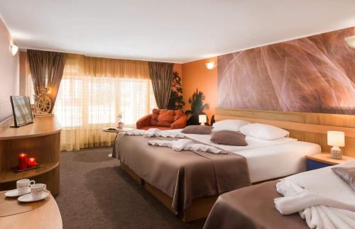 Кровать или кровати в номере Hotel Central Point