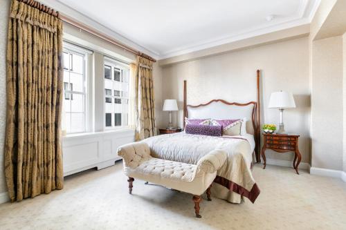 a bedroom with a large bed and a window at The Pierre, A Taj Hotel, New York in New York