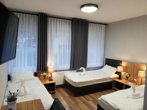 Postel nebo postele na pokoji v ubytování Jurajska Przystań
