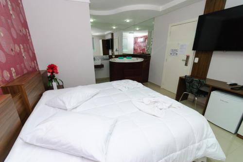 Hotel Paraiso客房内的一张或多张床位