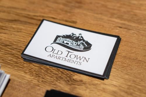 a sign for an old townarrangements on a table at Old Town Apartments in Kaufbeuren