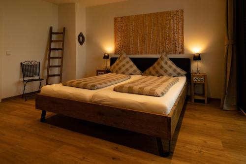 a bedroom with a large bed in a room at Old Town Apartments in Kaufbeuren