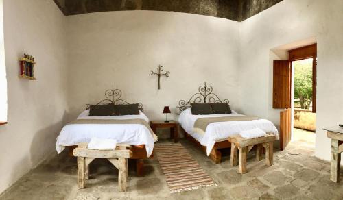Tempat tidur dalam kamar di Hacienda Santa Barbara Casa Malinche