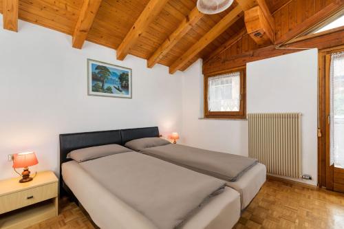 Voodi või voodid majutusasutuse Appartamenti Residenza Pineta toas