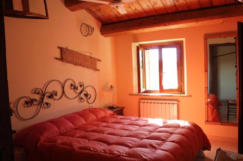 מיטה או מיטות בחדר ב-Country House Il Biroccio
