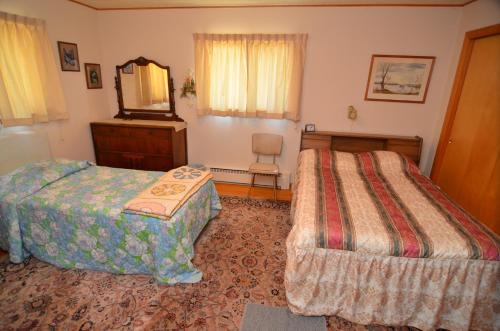 Voodi või voodid majutusasutuse Lakeside Bills Bay Cabin toas