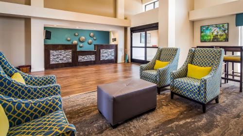 a waiting room with chairs and a table at Best Western Plus Yadkin Valley Inn & Suites in Jonesville
