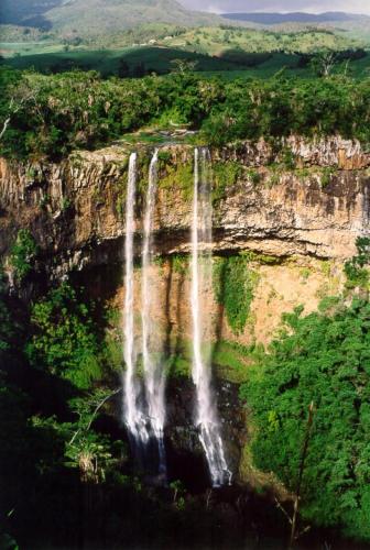 an aerial view of a waterfall on a cliff at Chez Cozy's in Albion