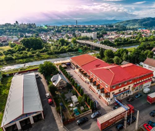 an overhead view of a city with a train station at Anomis in Cîmpulung