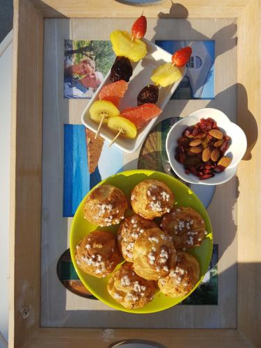 a table topped with plates of pastries and fruit at Le Mas Sophil in Carcès