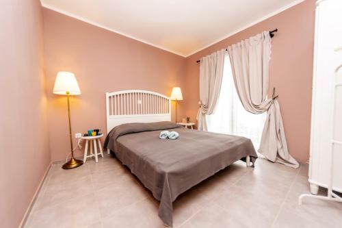 Ένα ή περισσότερα κρεβάτια σε δωμάτιο στο 24 Punta