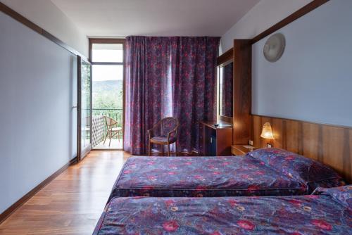 Postel nebo postele na pokoji v ubytování Park Hotel Oasi