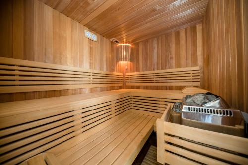 a wooden sauna with a sink in it at Apartments Dedić in Supetarska Draga