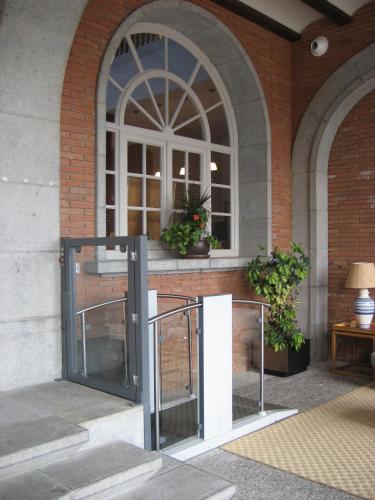 an entrance to a building with a glass door at Parador de Vic-Sau in Tavernoles
