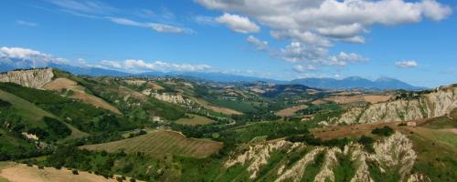 a view of a valley with mountains and trees at Casa San Martino in Atri