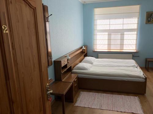 Ένα ή περισσότερα κρεβάτια σε δωμάτιο στο Jaunsīļi