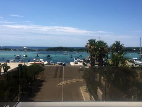 a view of a harbor with boats in the water at B&B Bella Costa - lungomare Porto Cesareo in Porto Cesareo