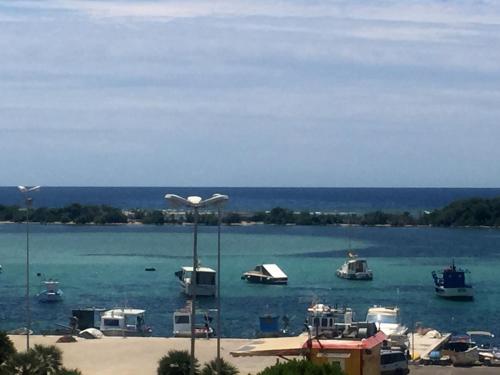 a group of boats floating in the water at B&B Bella Costa - lungomare Porto Cesareo in Porto Cesareo