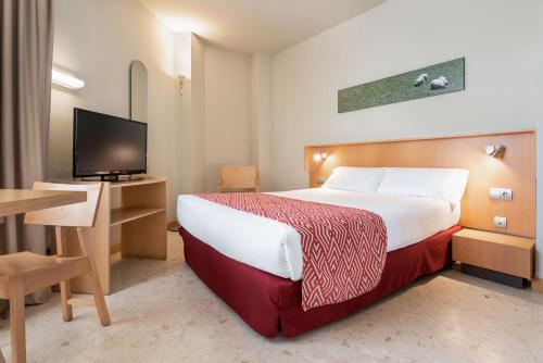 Postel nebo postele na pokoji v ubytování Aparthotel Exe Campus San Mamés
