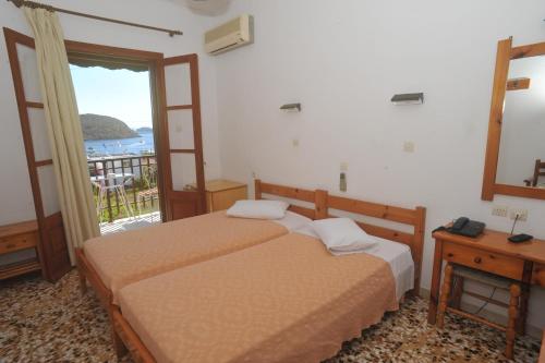 Postel nebo postele na pokoji v ubytování Casteli Hotel