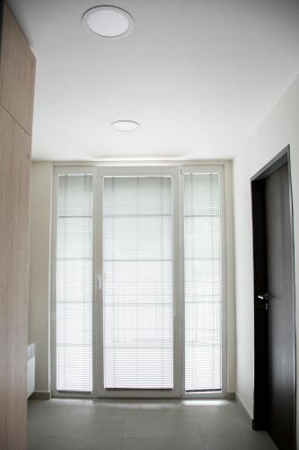 a large window in a room with white walls at Penzion Šafrán in Jeseník