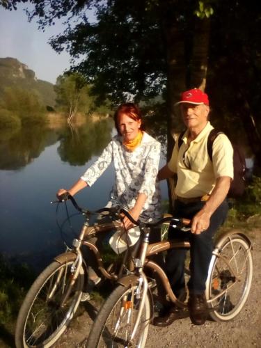 a man and a woman standing next to a bike at "LA TAVERNA" B&B in Airuno