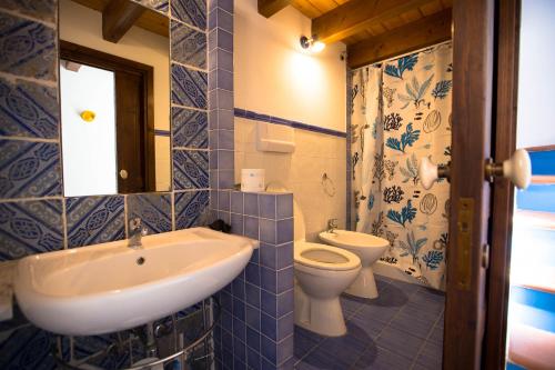 a bathroom with a sink and a toilet at Antiche scale in Castellammare del Golfo