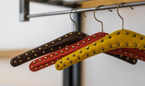 three baseball bats hanging on a rack at Vienna Hostel Ruthensteiner in Vienna