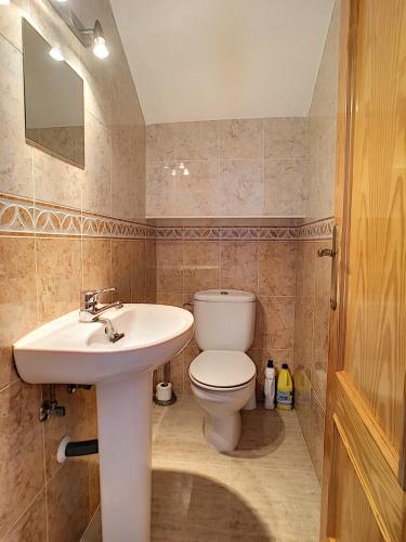 a bathroom with a white toilet and a sink at San Pedro del Pinatar House - 5409 in San Pedro del Pinatar