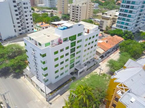 an overhead view of a white building in a city at Hotel Portobahia Santa Marta Rodadero in Santa Marta