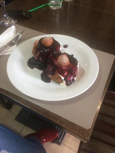 a white plate of food on a table at Provincial in Vişeu de Jos