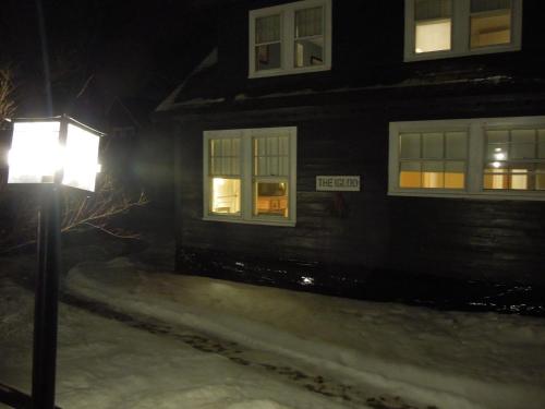 a street light in front of a house at night at Wildcat Inn and Tavern in Jackson