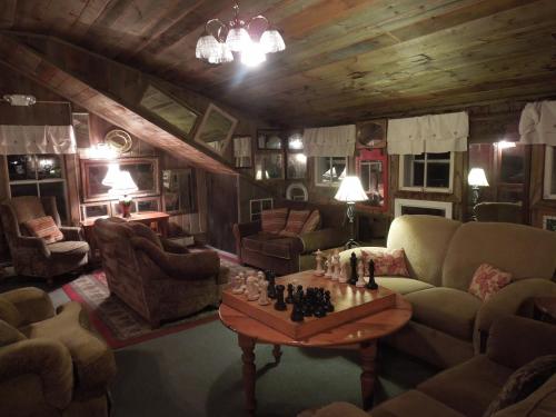 a living room filled with furniture and a chess board at Wildcat Inn and Tavern in Jackson