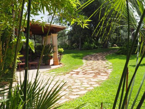 a path leading to a garden with a gazebo at Son Mercadal in Porreres