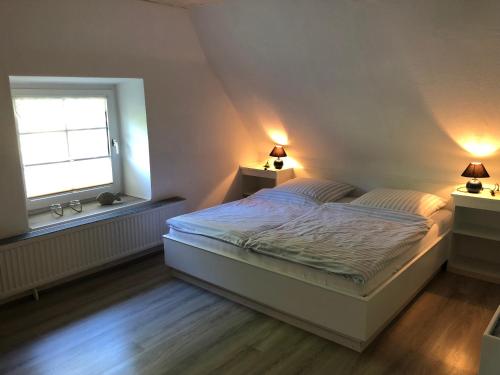 En eller flere senge i et værelse på Landhaus Gonnsen