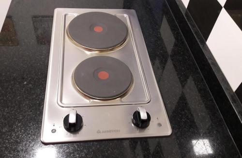 a remote control sitting on top of a table at Departamento España in Mendoza
