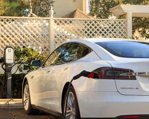 a white car parked next to a parking meter at Cheshire Cat Inn & Cottages in Santa Barbara