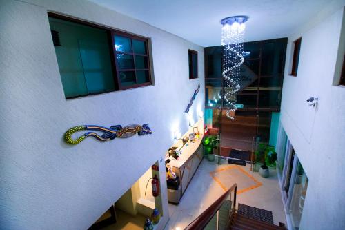 a room with a staircase with a christmas ornament on the wall at Hotel Isleño in Isla Mujeres