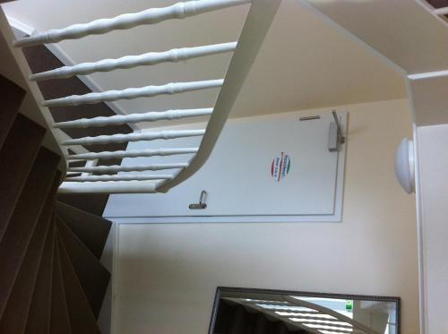 a ceiling in a room with a white rafters at Hotel Appart in Osnabrück