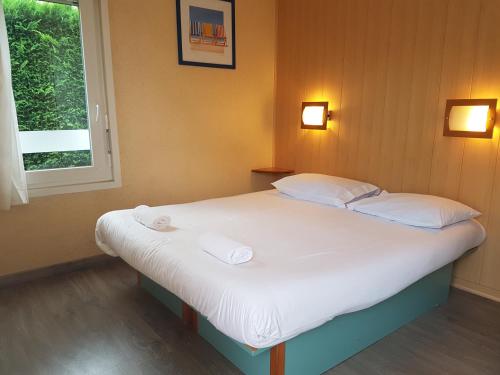 Ένα ή περισσότερα κρεβάτια σε δωμάτιο στο Fasthotel Carcassonne