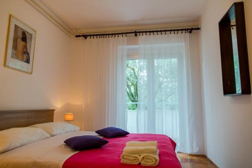 Postel nebo postele na pokoji v ubytování Apartments Villa Lena