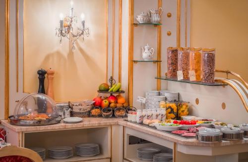 a table with a bunch of food on it at Schlosshotel Römischer Kaiser in Vienna