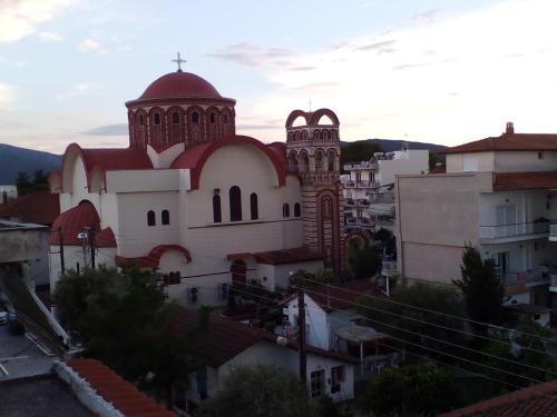 a church on top of a city with roofs at Central Fountain in Asprovalta