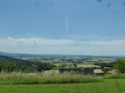 a view of the countryside from a hill with green grass at tempepailla in Roynac